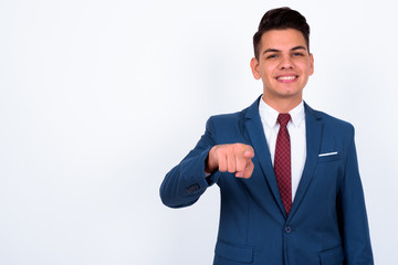 Portrait of happy young handsome multi ethnic businessman in suit