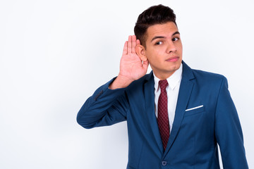 Portrait of young handsome multi ethnic businessman in suit
