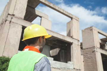 Construction worker with helmet in outdoors.