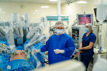 Surgery operation. Group of surgeons in operating room with surgery equipment. Medical background,...