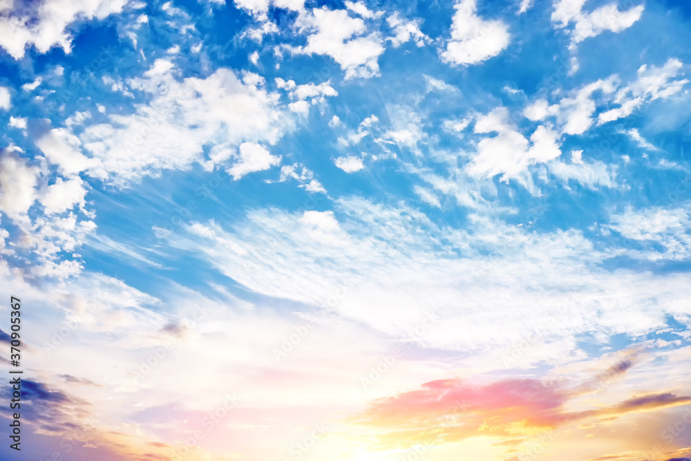 Wall mural cold sunset sky landscape background with sun below horizon. wide view of clouds skyline on evening.