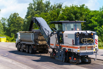 Heavy machinery on a construction site against blue sky. New road building.