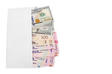 Ukrainian hryvnia and dollars in a white envelope isolated on a white background. View from above. Copy of space.