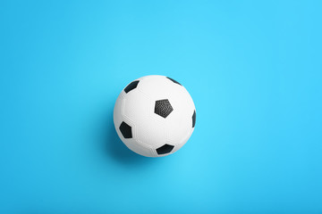 Fototapeta na wymiar Soccer ball on color background