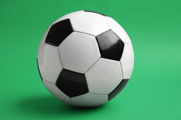 Naklejka premium Soccer ball on color background