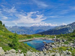 Naklejka na ściany i meble Beautiful moutain lake in the french alps. 