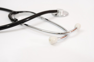 Medical stethoscope on a white background. Close-up.