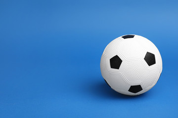 Fototapeta na wymiar Soccer ball on color background