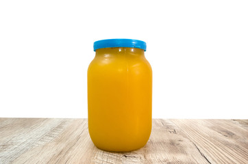 honey in a jar on a wooden table. Sunflower honey.