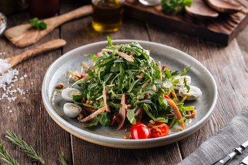 Arugula salad with turkey nuts and quail eggs
