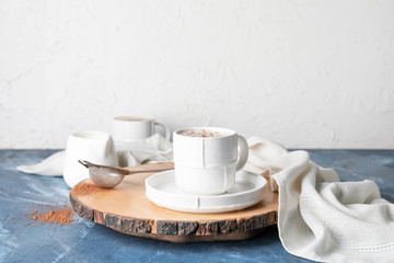 Cup of hot coffee on table