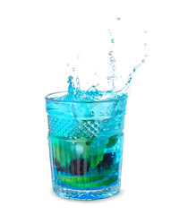 Glass of tasty blue mojito cocktail with splashes on white background