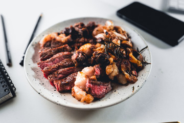 Steak slices in a plate on the home desk.Homemade food