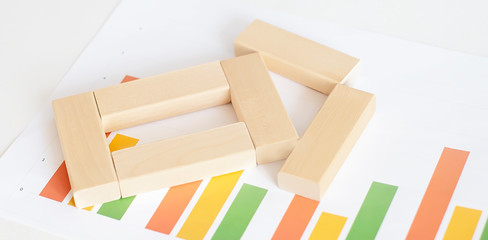 Wooden block toy isolated on the chart background.