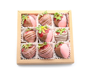 Box with tasty glazed strawberry on white background