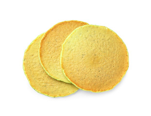 Tasty green pancakes on white background