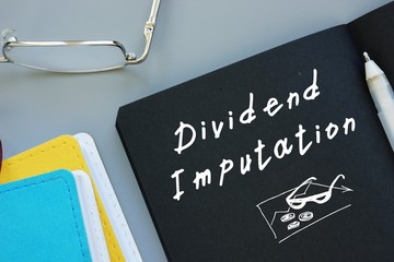 Business concept meaning Dividend Imputation with inscription on the piece of paper.