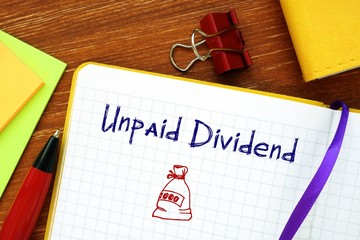 Business concept meaning Unpaid Dividend with phrase on the sheet.