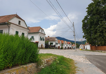 Rimetea village main street houses on cloudy day