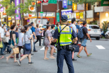 The police patrolling at the crossroads to guard the safety of the people