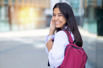 Fototapeta premium Happy smiling Asian woman, female student goes to study