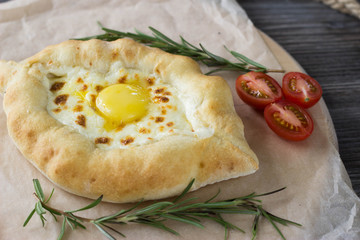 Adjarian khachapuri on the table in a cafe