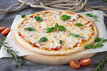 Pizza Margarita with Basil leaves on top