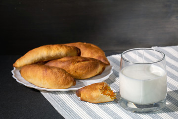 Homemade pies from oven with milk glass. Traditional bakery products