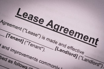 Concept of commercial, lease, tenancy, contract, property or commercial laws: the partial of first page of lease agreement with heavy vignette.