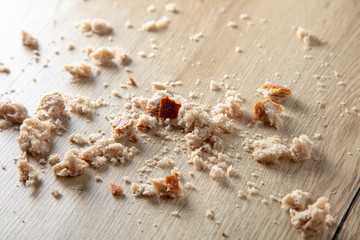 Obraz na płótnie Canvas Bread crumbs on a wooden table.