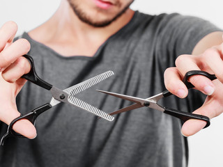 Man with scissors for haircutting