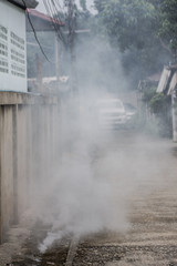 Officers enter the area to spray fog to prevent dengue fever.