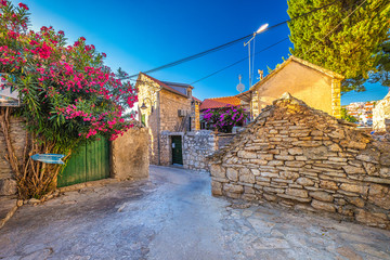 Street of Primosten town, a popular tourist destination on the Dalmatian coast of Adriatic sea in...