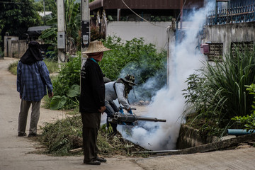 Officers enter the area to spray fog to prevent dengue fever.