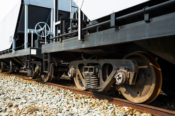 focus on the close-up of the train wheels, which is a presentation of strength and beauty.