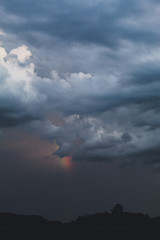 rainbow over thunder clouds