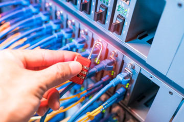 hand with network and data protection concept with padlock and switch