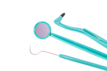 Set of dental cleaning tools including a toothbrush dental floss disposable and plastic flossing tool in an oral hygiene concept