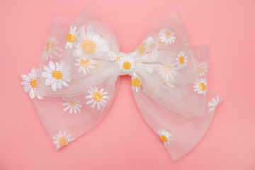 Beautiful hair bow for girls on pink background.