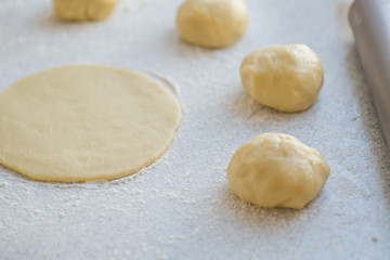 Fototapeta na wymiar Step-by-step instructions for making bagel cookies for use in recipe illustrations. Balls of dough, blanks. step 2