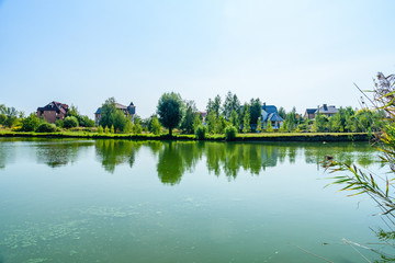 Houses on a bank of river Khorol in Myrhorod, Ukraine. Summer landscape