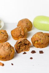 chocolate muffins with zucchini and banana. wet veggie cupcakes home-made, top view on a light background. cooking muffins in the kitchen . in the split view