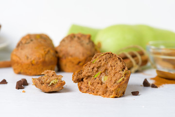chocolate muffins with zucchini and banana. wet veggie cupcakes home-made, top view on a light background. cooking muffins in the kitchen . in the split view
