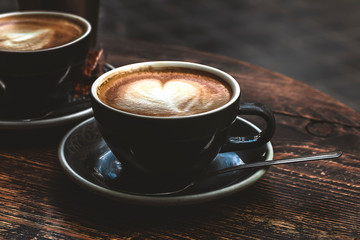 Selective focus of cup of coffee cappuccino with foam heart