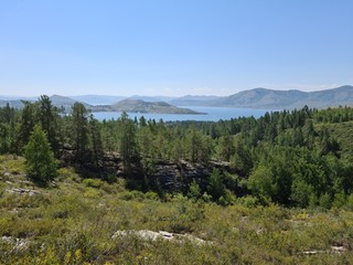 Natural landscape. Mountain lake surrounded by forest.