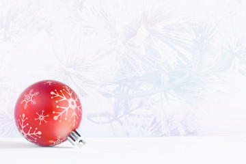 Christmas ball on a light background 