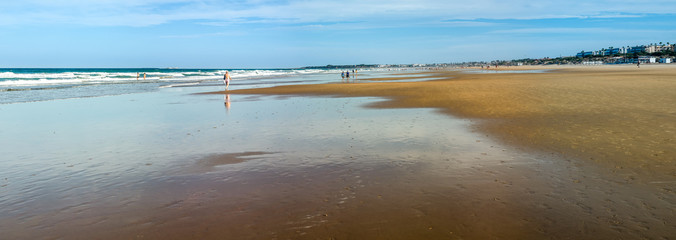 La Barrosa beach in Sancti Petri, Cádiz, with a large amount of sand without water as the tide is low