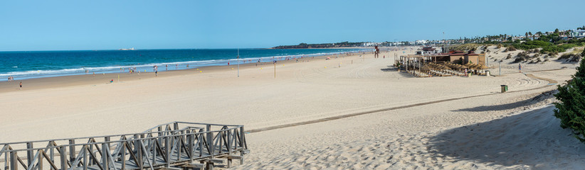 La Barrosa beach in Sancti Petri, Cádiz, with a large amount of sand without water as the tide is low