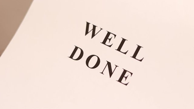 Printer prints the sheet of paper with "WELL DONE" text