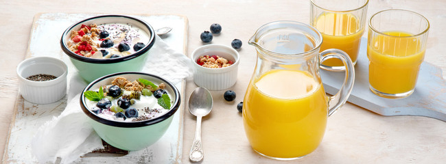 Yogurt breakfast bowls with granola and fruits